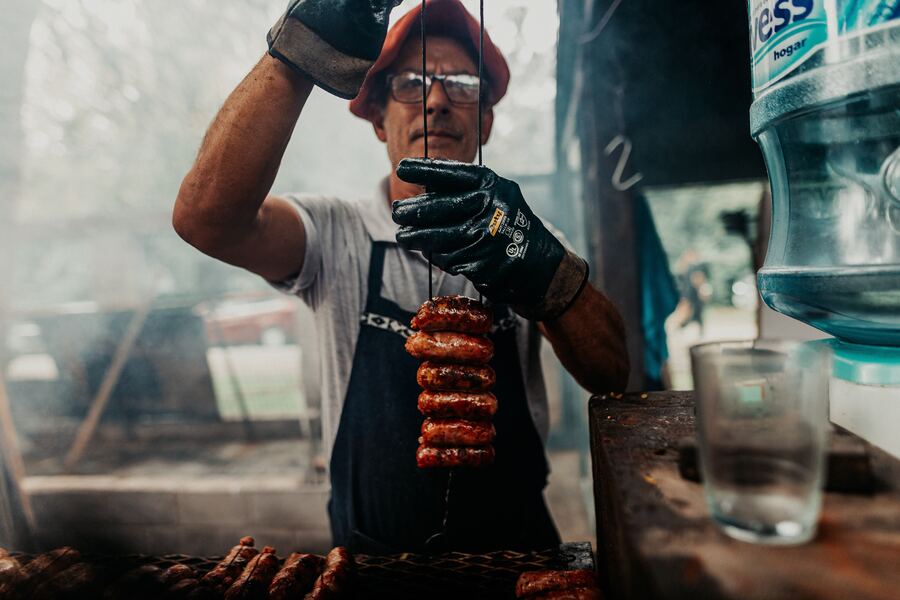 Grilled sausage skewer at a street barbecue in the Americas